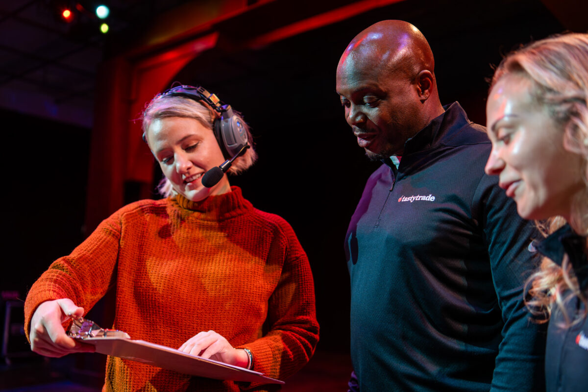 logistics team helping a speaker on stage